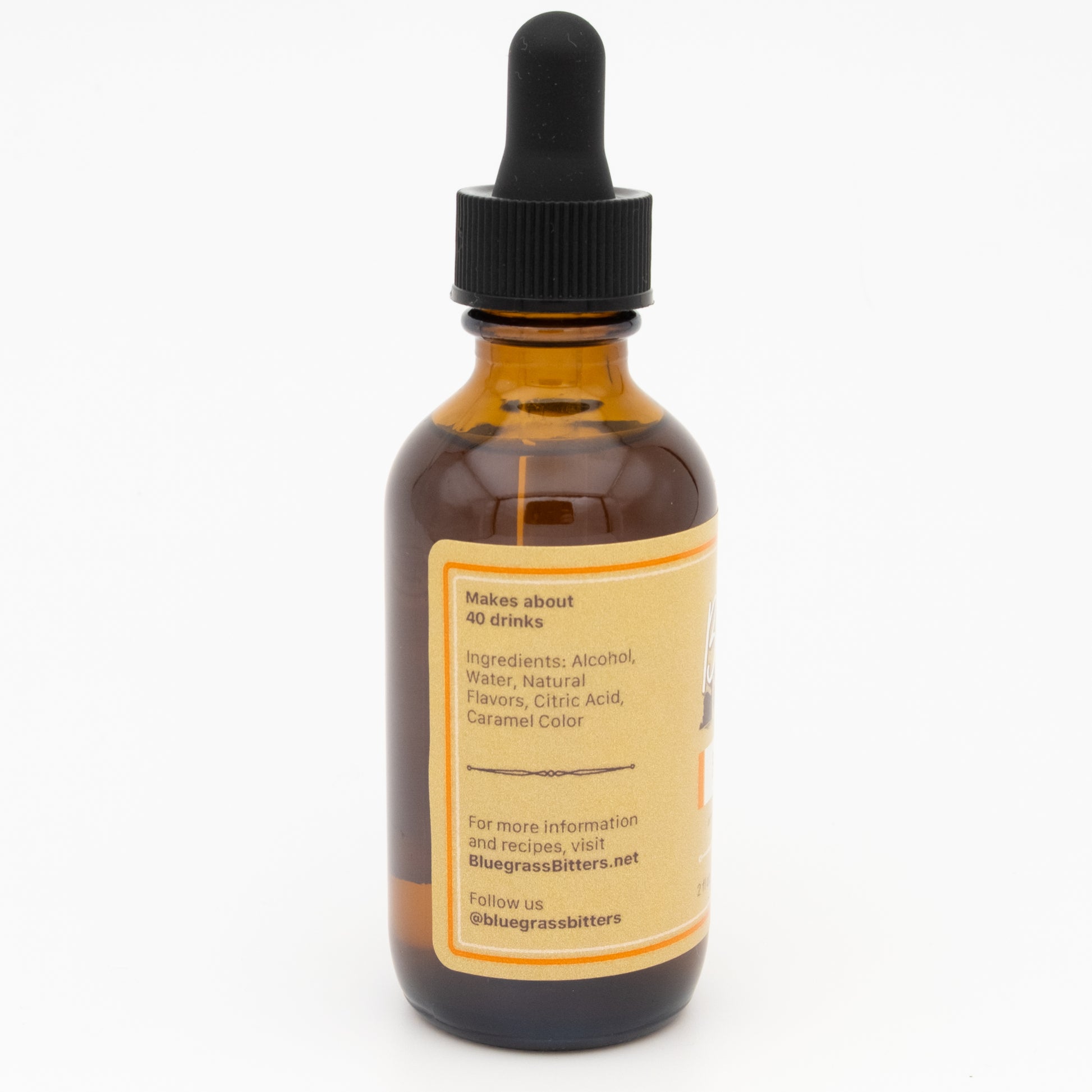 Bottle of bitters with a dropper on a white background