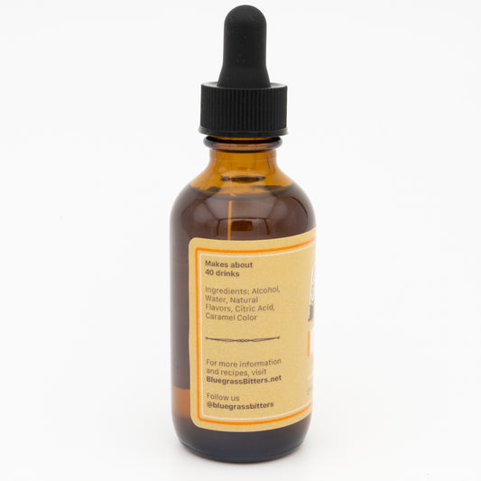 Bottle of bitters with a dropper on a white background